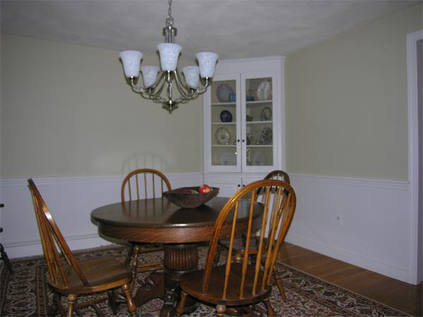 89 Brook Trail Road Concord, MA 01742 - Photo 7 of 18 a view of a dining room with furniture and chandelier