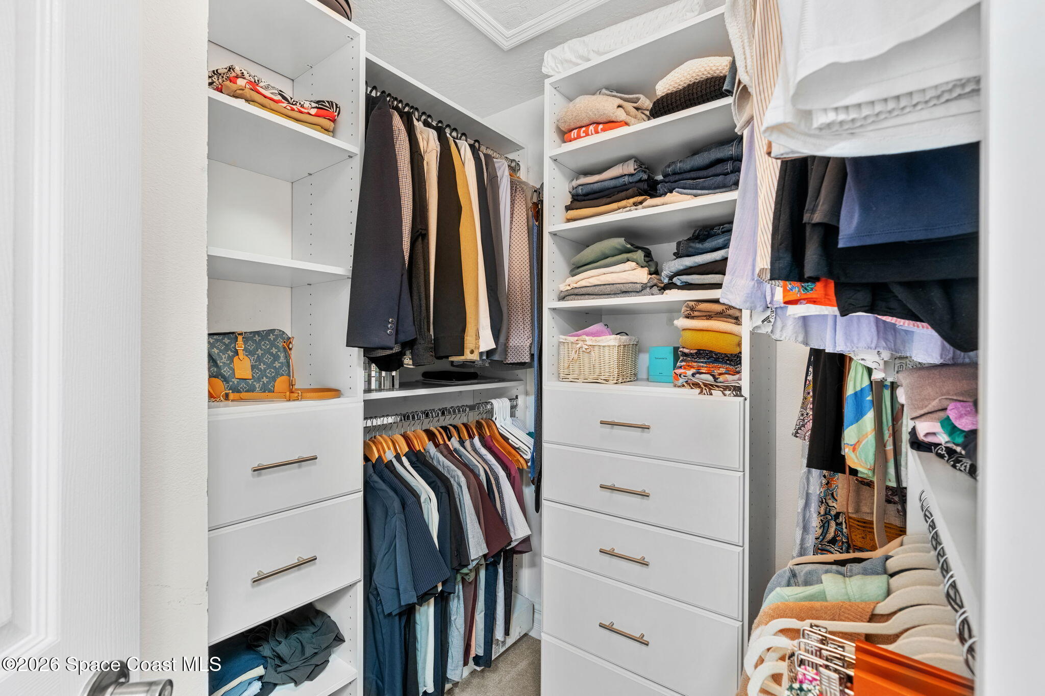 3 Jennifer Circle Indialantic, FL 32903 - Photo 37 of 61 a view of walk in closet with clothes and shoes