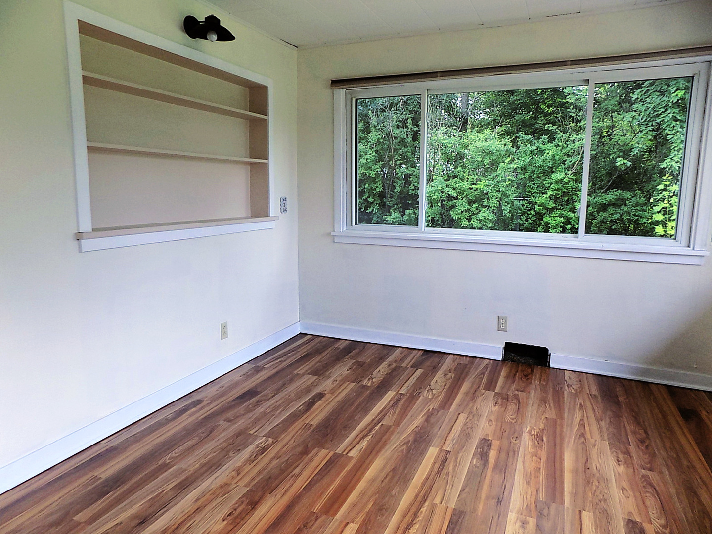 409 Burns Street Rutland, IL 61358 - Photo 8 of 38 a view of empty room with wooden floor and fan