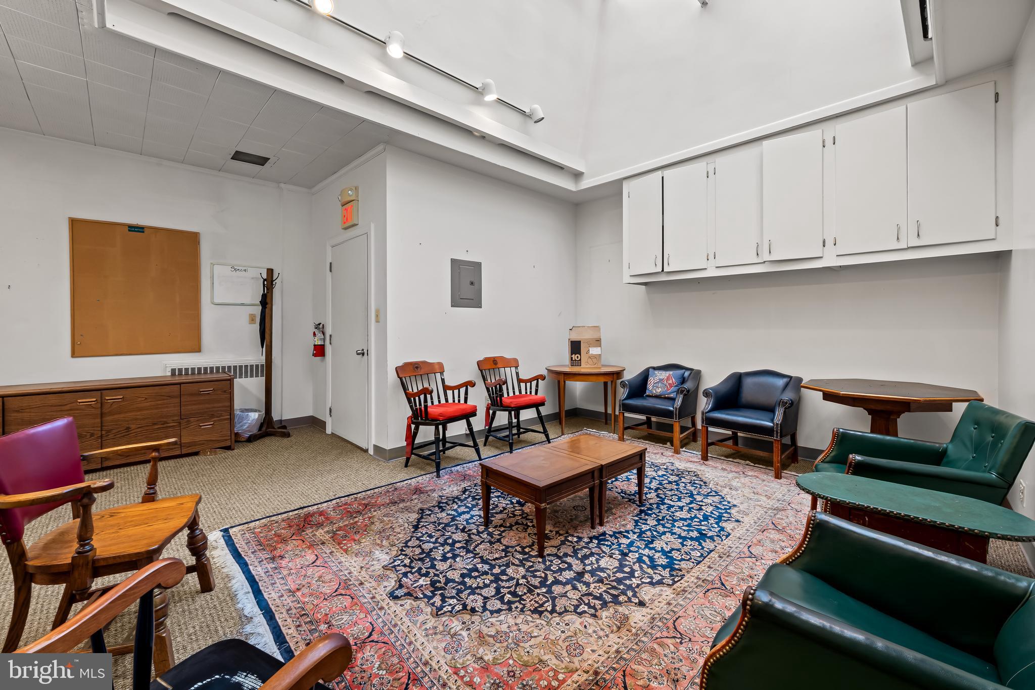 212 Duke Of Gloucester Street Annapolis, MD 21401 - Photo 11 of 23 a living room with furniture a rug and a wooden floor