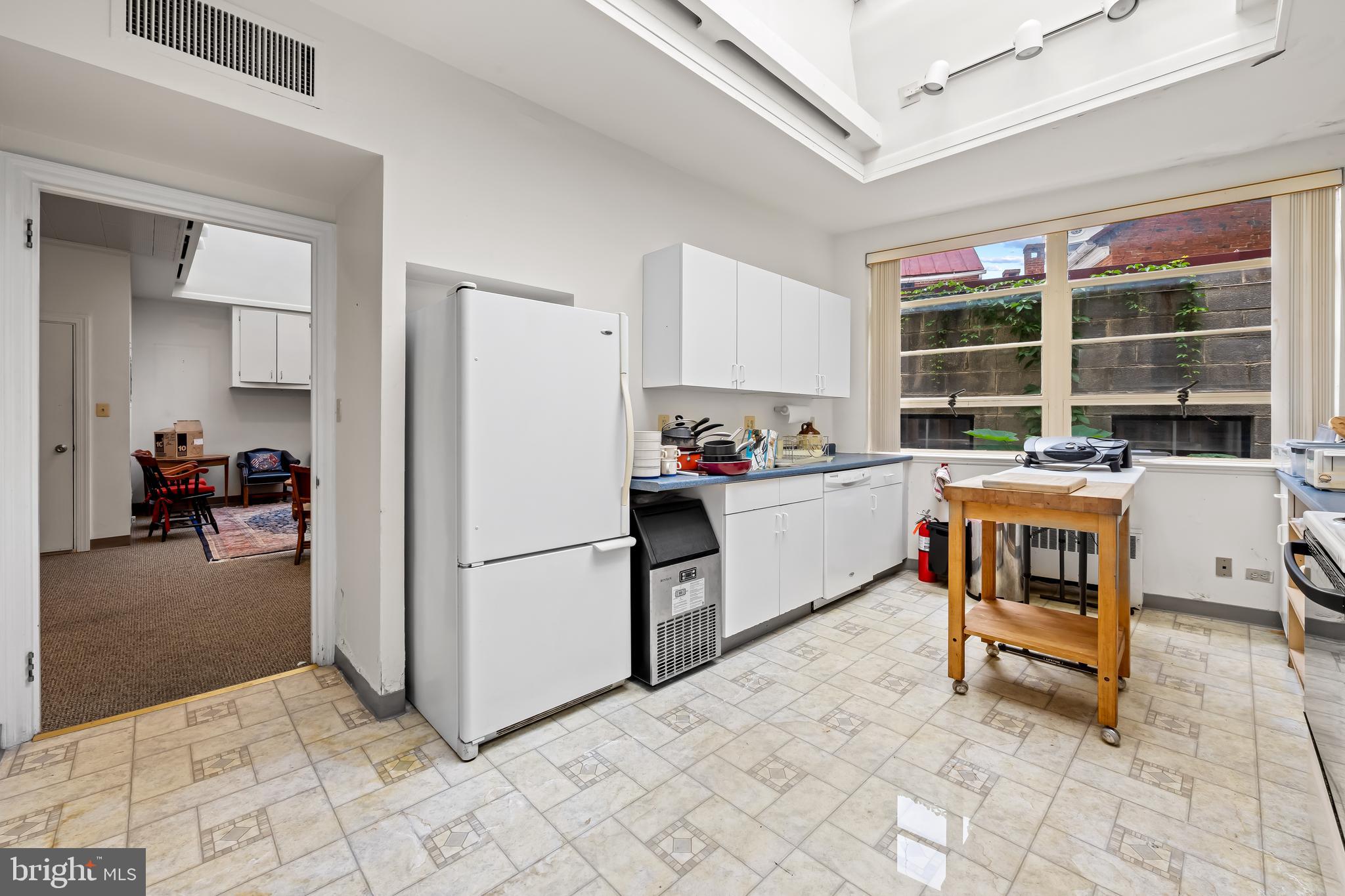 212 Duke Of Gloucester Street Annapolis, MD 21401 - Photo 4 of 23 a kitchen with a refrigerator and a sink