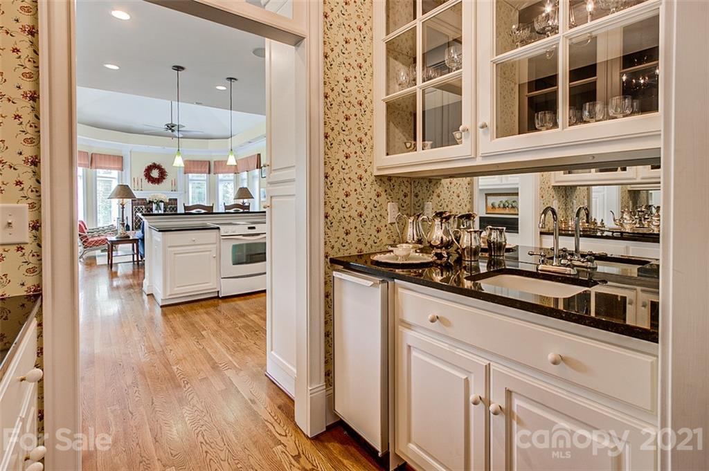 2215 Old Lexington Road Asheboro, NC 27205 - Photo 13 of 48 a kitchen with stainless steel appliances and wooden floor