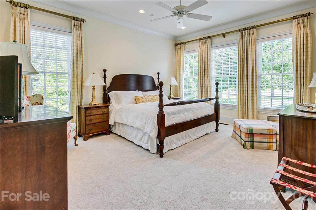 2215 Old Lexington Road Asheboro, NC 27205 - Photo 19 of 48 a bedroom with furniture and large windows