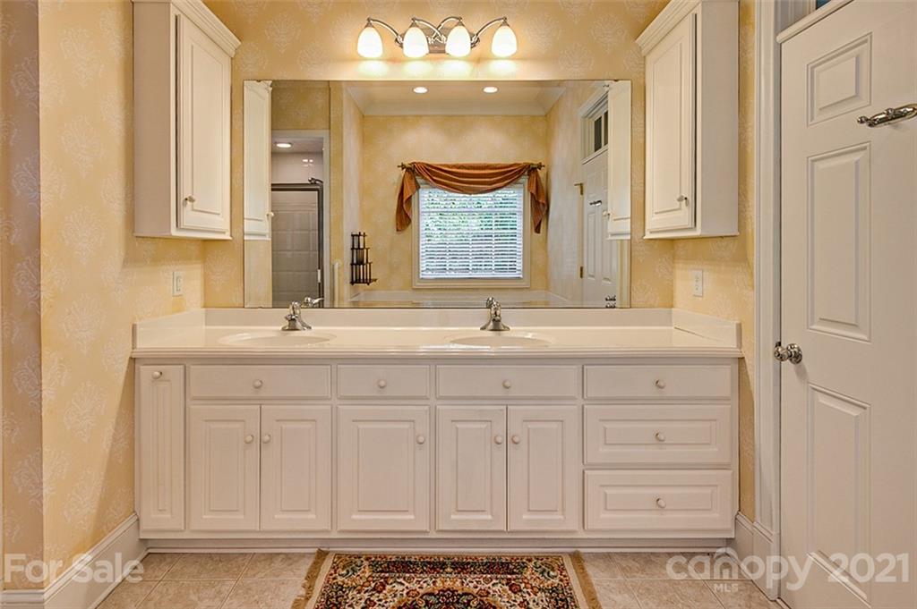 2215 Old Lexington Road Asheboro, NC 27205 - Photo 20 of 48 a bathroom with a sink vanity and a mirror