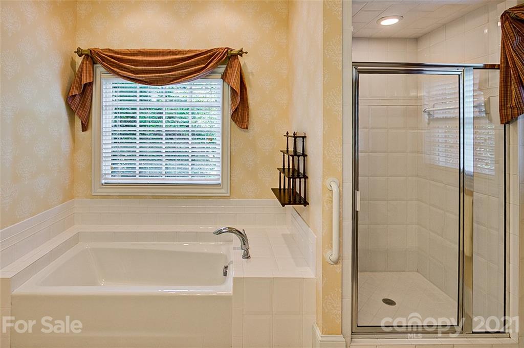 2215 Old Lexington Road Asheboro, NC 27205 - Photo 21 of 48 a bathroom with a shower and a bathtub