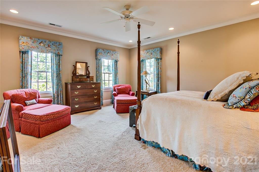2215 Old Lexington Road Asheboro, NC 27205 - Photo 22 of 48 a bedroom with furniture and a chandelier