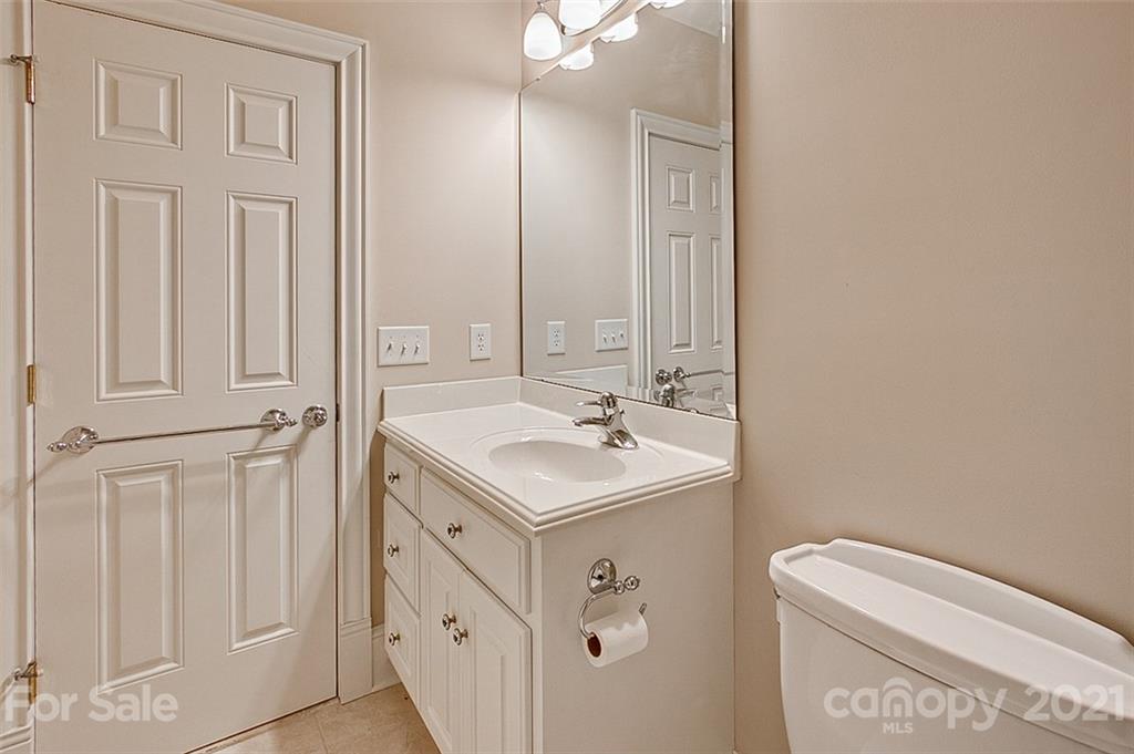 2215 Old Lexington Road Asheboro, NC 27205 - Photo 27 of 48 a bathroom with a sink a toilet and a mirror