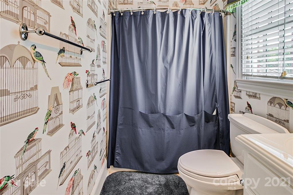 2215 Old Lexington Road Asheboro, NC 27205 - Photo 31 of 48 a white toilet sitting next to a bathroom