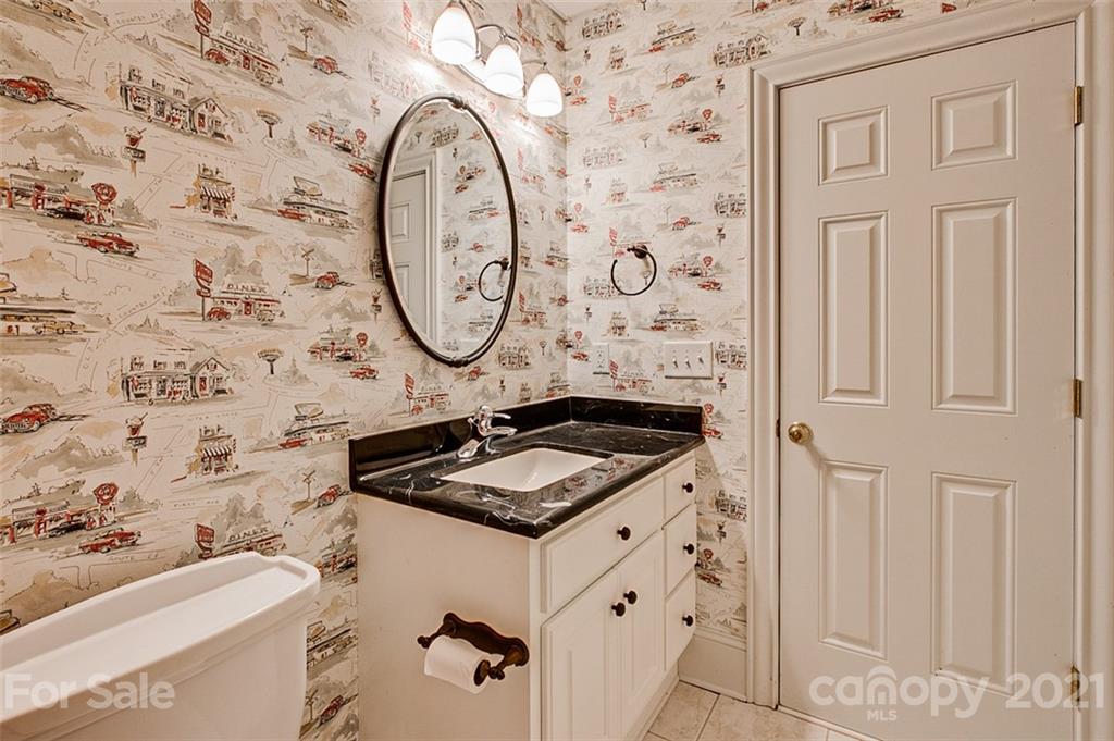 2215 Old Lexington Road Asheboro, NC 27205 - Photo 33 of 48 a bathroom with a granite countertop sink and a mirror