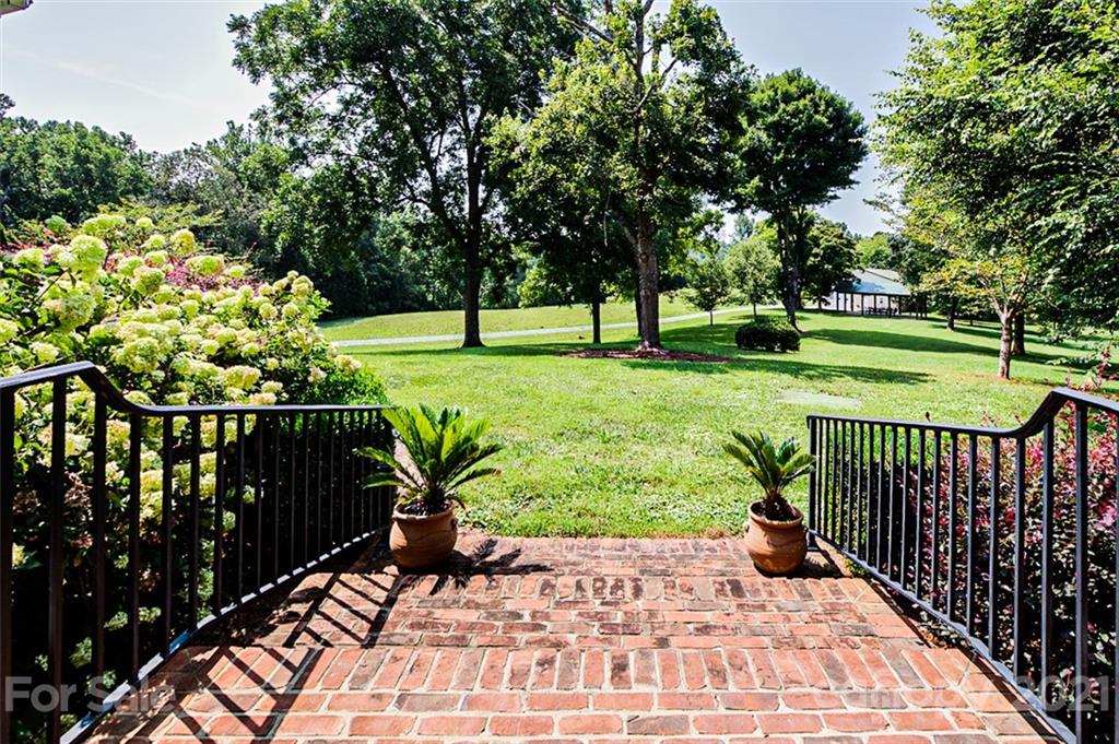 2215 Old Lexington Road Asheboro, NC 27205 - Photo 39 of 48 a view of a backyard with a garden