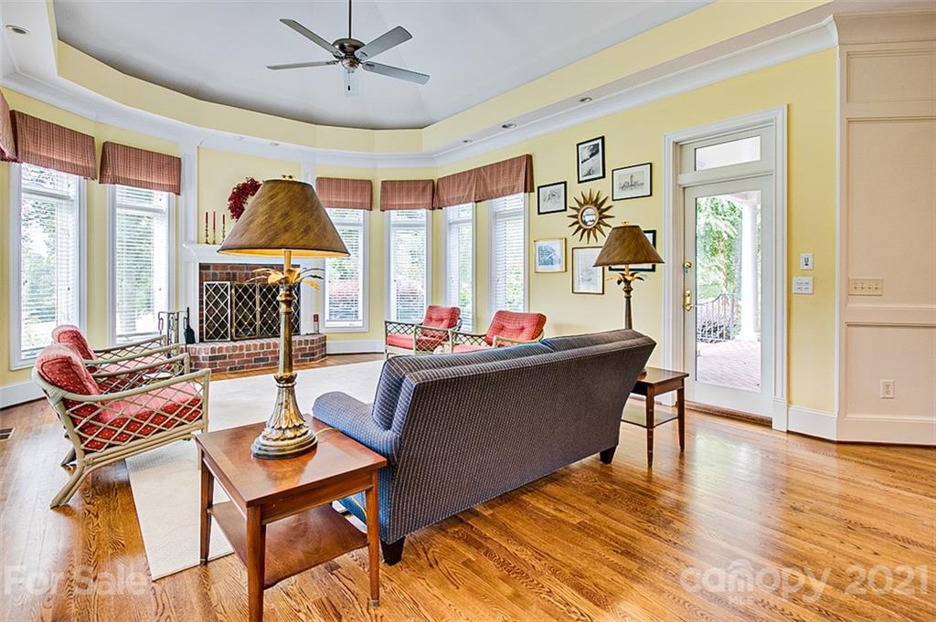 2215 Old Lexington Road Asheboro, NC 27205 - Photo 7 of 48 a living room with furniture a window and a chandelier