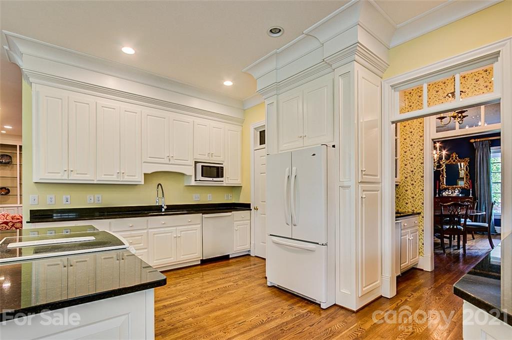2215 Old Lexington Road Asheboro, NC 27205 - Photo 10 of 48 a kitchen with granite countertop white cabinets and white appliances