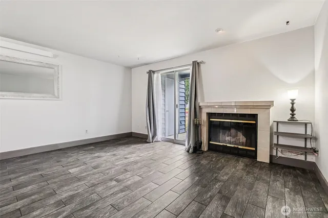 a view of a livingroom with a fireplace a fireplace and entryway