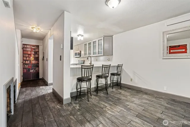 a view of kitchen with furniture and wooden floor