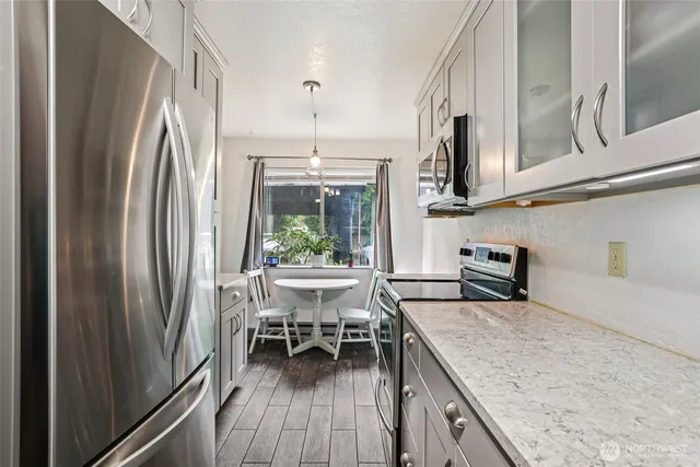 a view of a room with an empty room and kitchen
