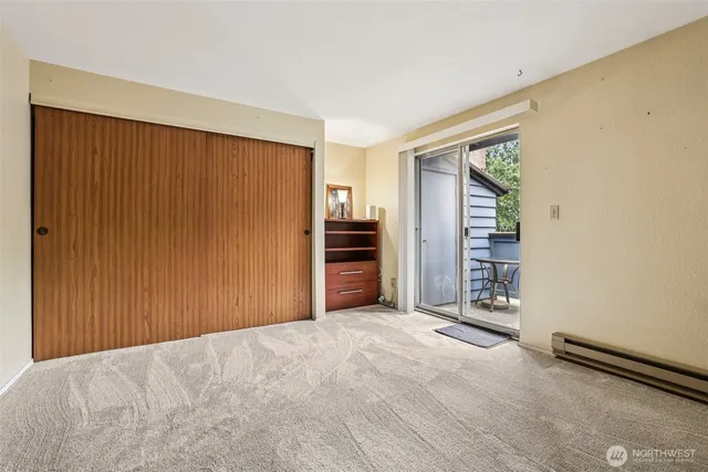 a bedroom with bed and a walk in closet