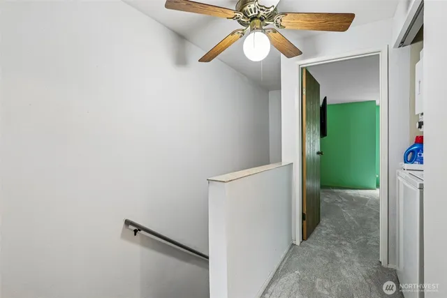 a view of a big room with closet and windows