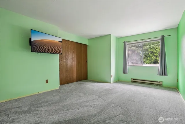 a bathroom with a sink toilet and a mirror