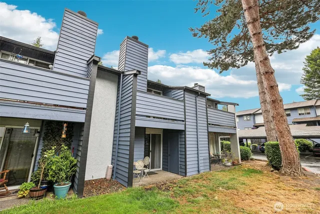 a front view of a building with garden