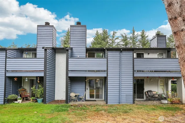a view of a chair and table in the balcony