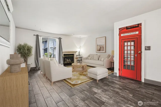 a living room with furniture a dining table and a potted plant