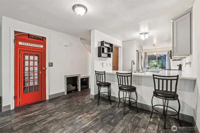 a view of a livingroom with furniture and a fireplace