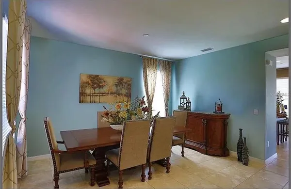a view of a dining room with furniture