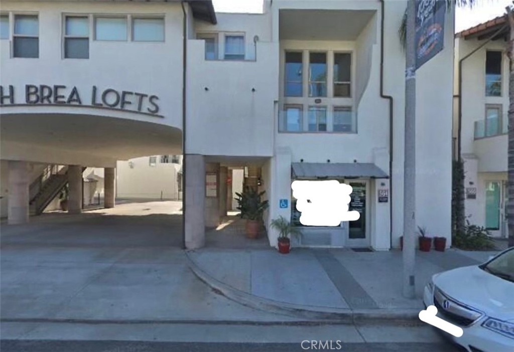 a view of a livingroom with furniture and fireplace