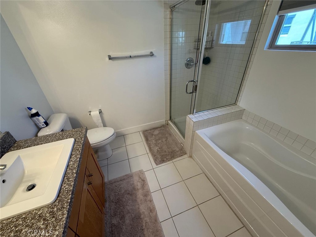 550 South Brea Boulevard Brea, CA 92821 - Photo 14 of 17 a bathroom with a bathtub and a shower