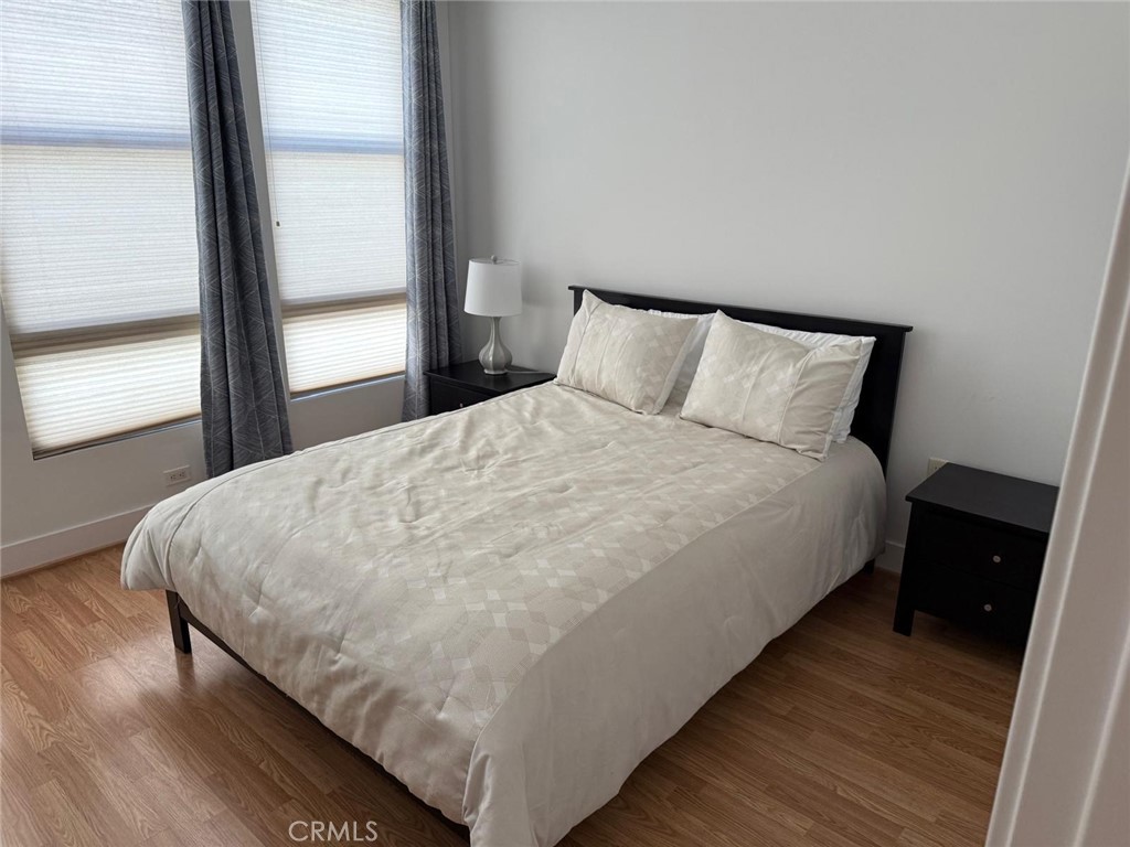 550 South Brea Boulevard Brea, CA 92821 - Photo 15 of 17 a large bed sitting in a bedroom next to a window