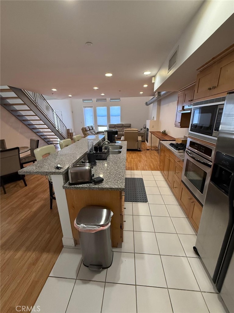 550 South Brea Boulevard Brea, CA 92821 - Photo 6 of 17 a kitchen with a sink appliances and cabinets
