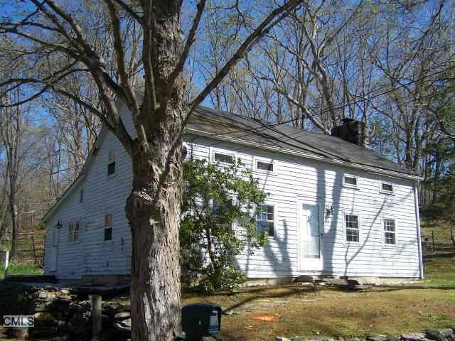 a view of a house with a tree
