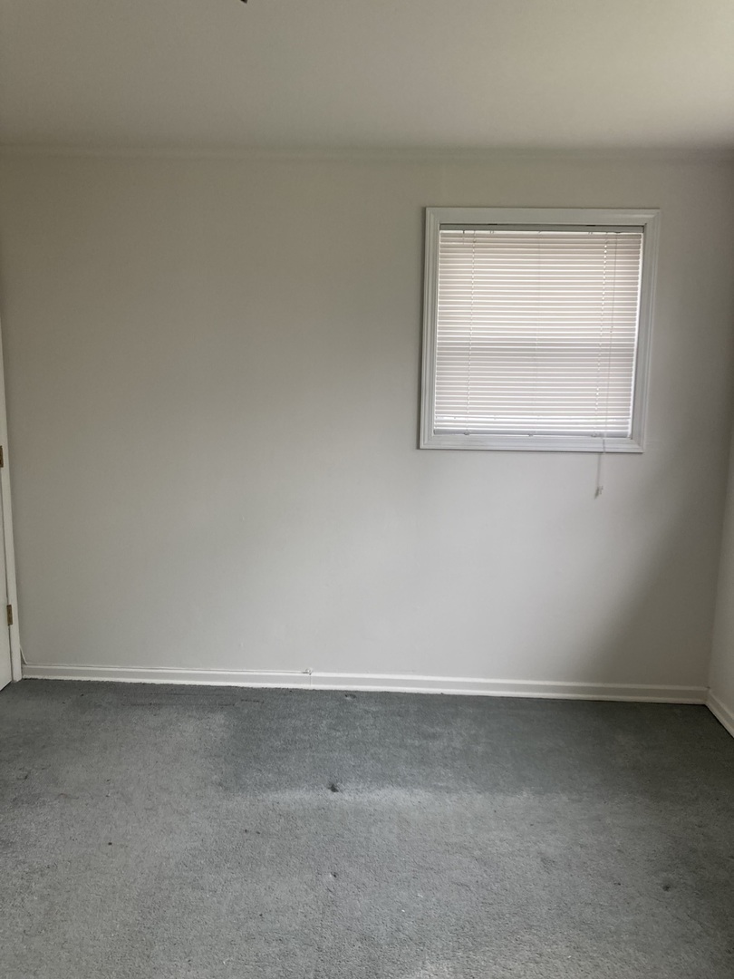 2155 Spruce Road Homewood, IL 60430 - Photo 6 of 18 an empty room with a window