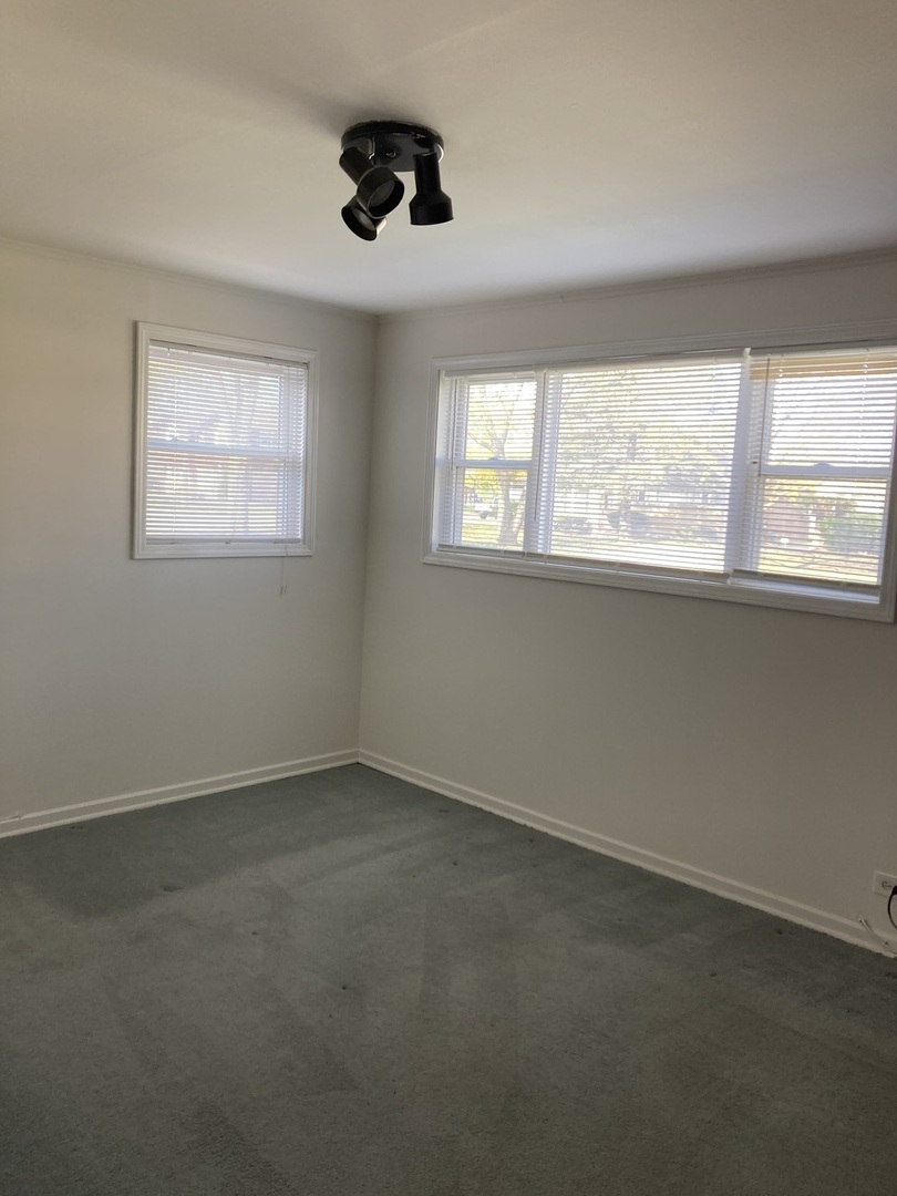 2155 Spruce Road Homewood, IL 60430 - Photo 8 of 18 an empty room with a window