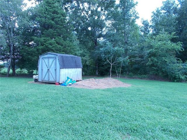 1301 Fleeman Road Lawrenceburg, TN 38464 - Photo 3 of 19 a backyard of a house with wooden fences and trampoline