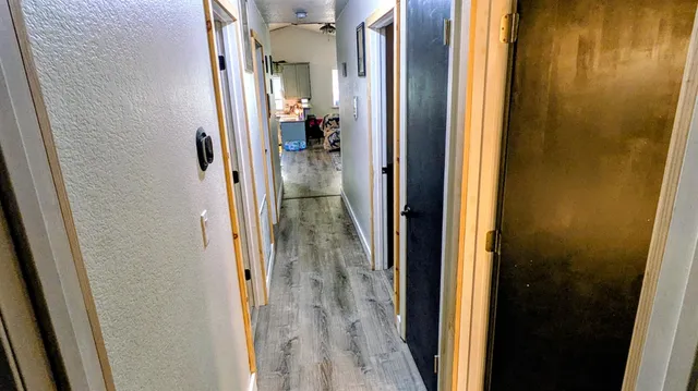 a view of a bathroom from a hallway