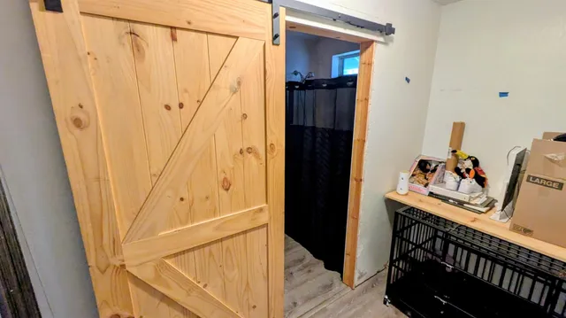 a bathroom with a shower and a sink