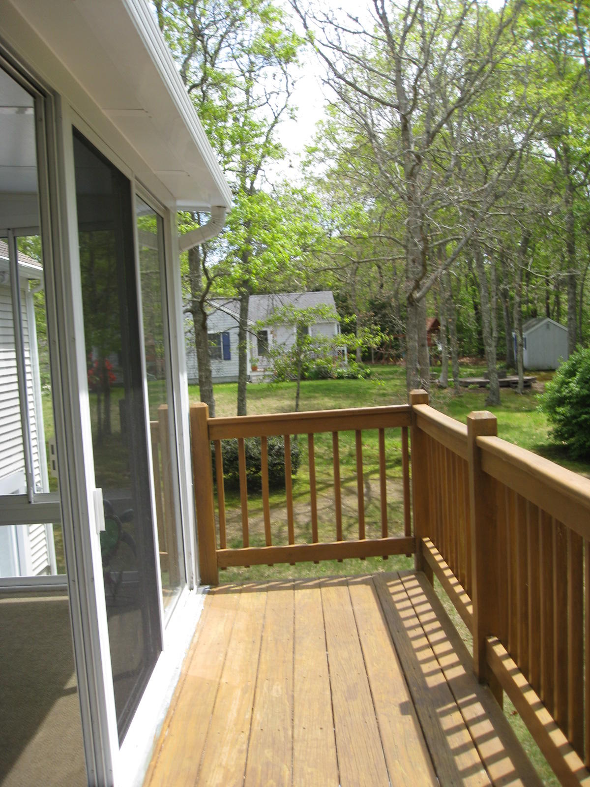 149 Camelback Road Marstons Mills, MA 02648 - Photo 19 of 25 a view of a two chairs with wooden floor in front of house