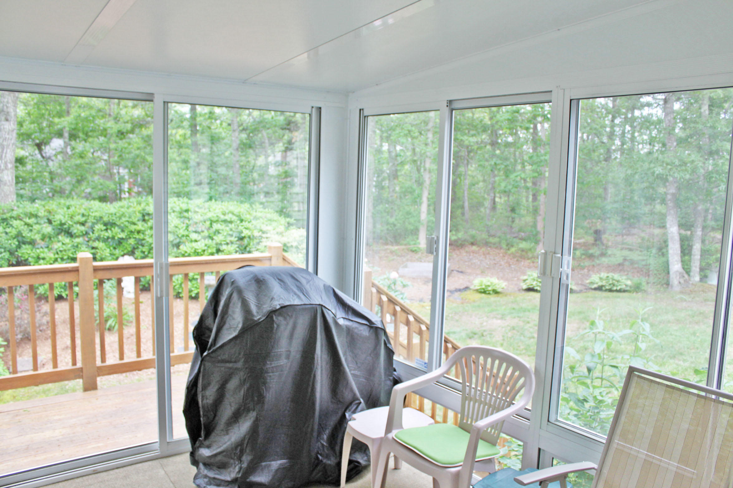 149 Camelback Road Marstons Mills, MA 02648 - Photo 8 of 25 a view of a city from a dining room with large windows