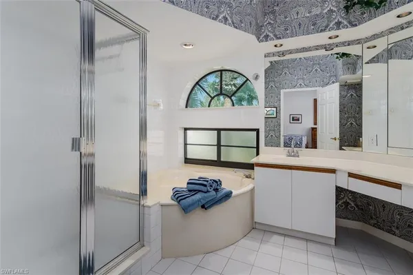 a bedroom with a bed and a table in it