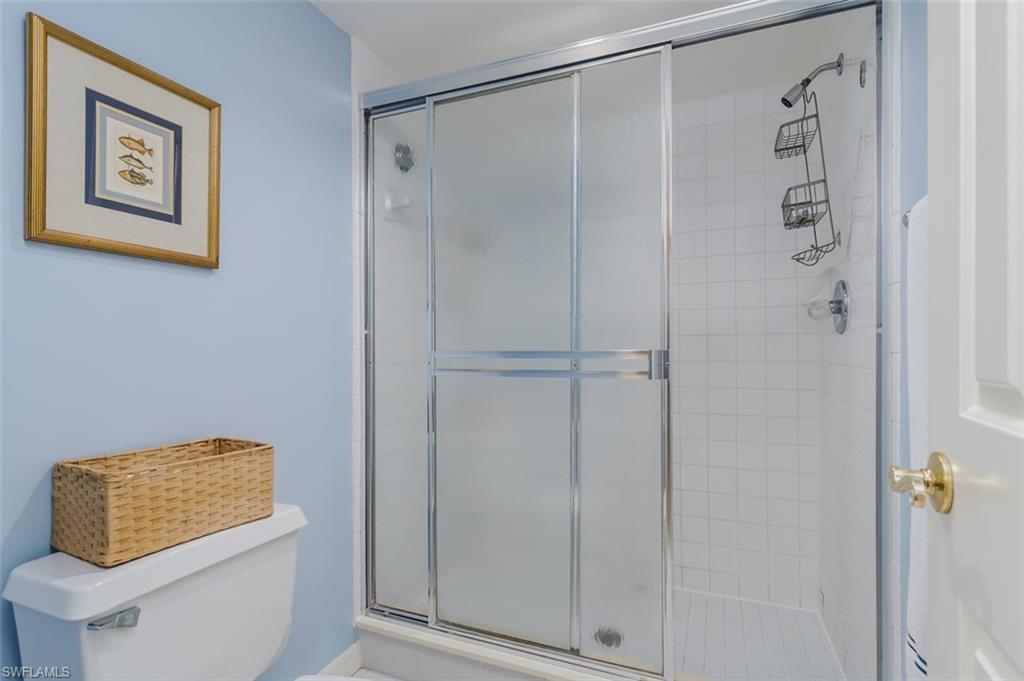 6545 Valen Way, Unit F205 Naples, FL 34108 - Photo 19 of 40 a bathroom with a shower and a sink