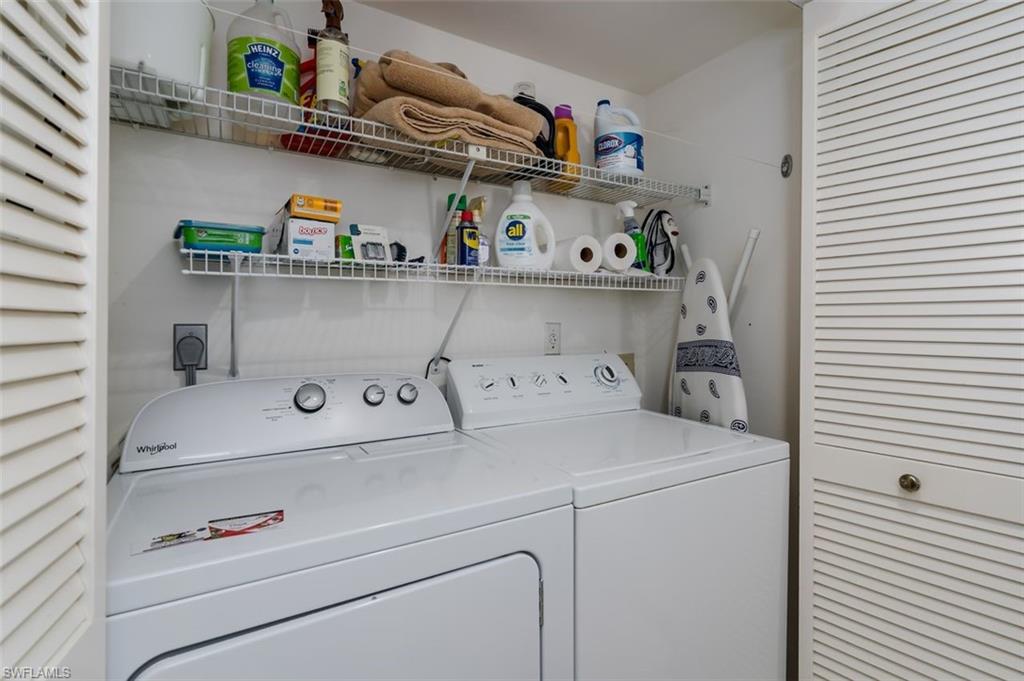 6545 Valen Way, Unit F205 Naples, FL 34108 - Photo 25 of 40 a utility room with dryer and washer