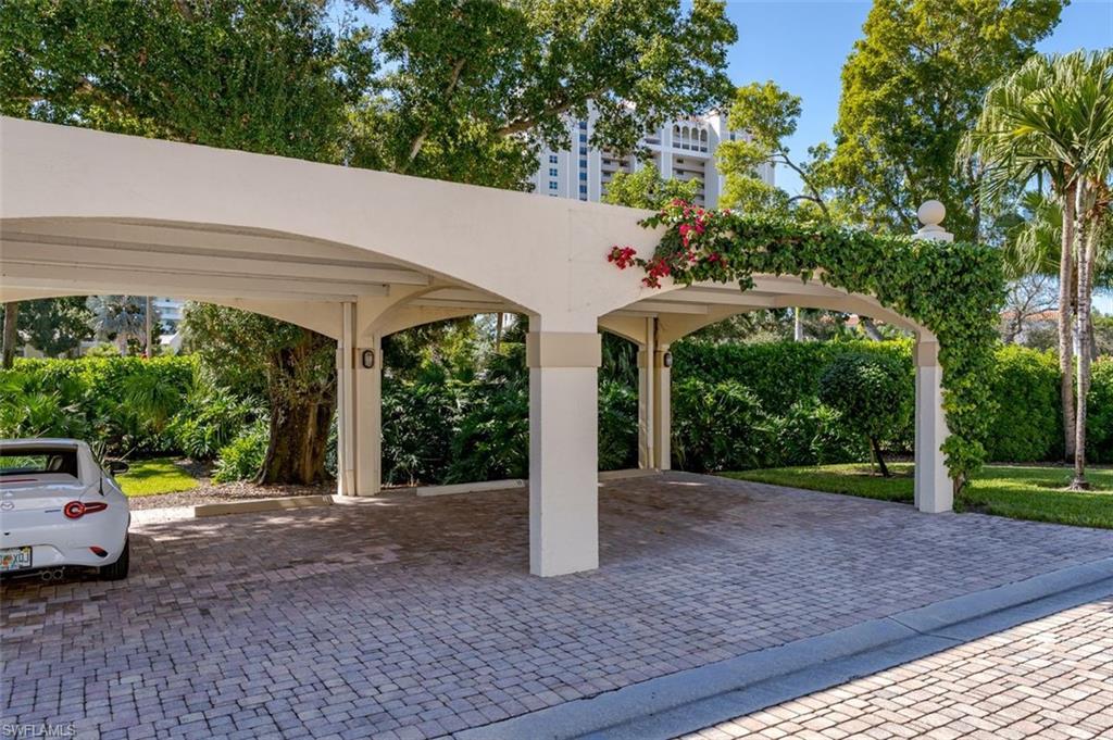 6545 Valen Way, Unit F205 Naples, FL 34108 - Photo 27 of 40 a front view of a house with garden