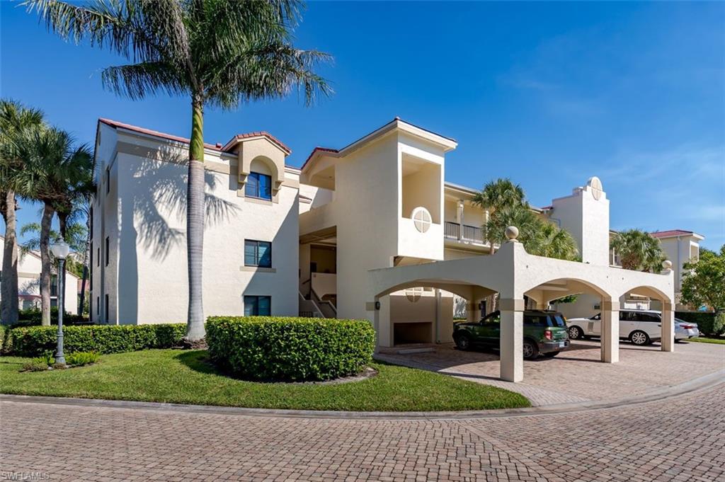 6545 Valen Way, Unit F205 Naples, FL 34108 - Photo 28 of 40 a front view of a house with garden