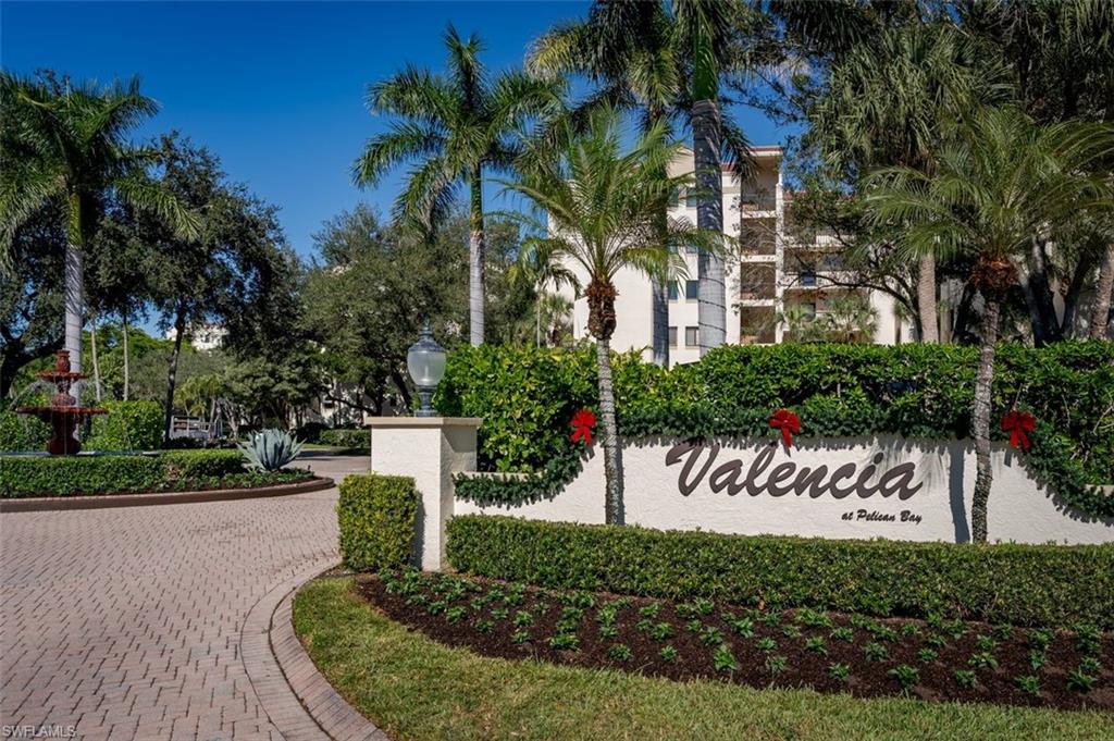 6545 Valen Way, Unit F205 Naples, FL 34108 - Photo 29 of 40 a front view of a house with a yard