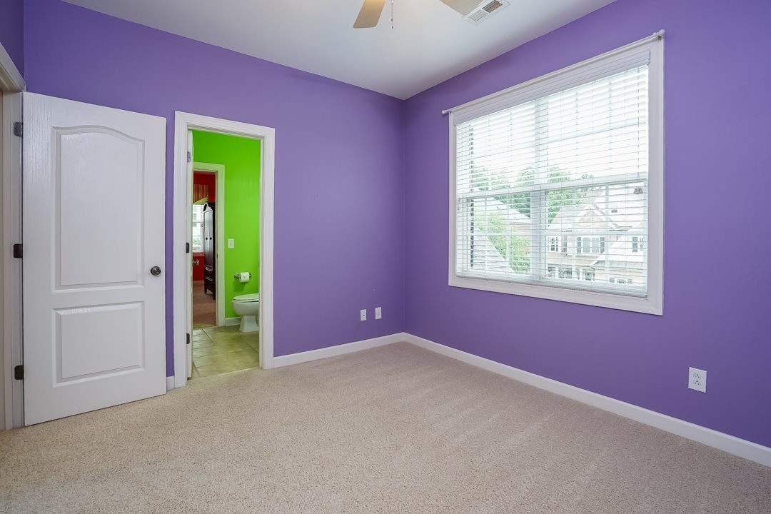 2920 Elmfield Street Raleigh, NC 27614 - Photo 26 of 30 Nice double window overlooking the front yard and a double closet. A ceiling fan tops the room. Direct access to shared bath with bedroom 3. Bedroom 4
