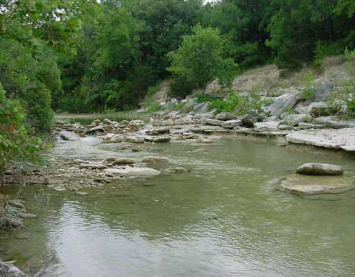 143 River Road Liberty Hill, TX 78642 - Photo 1 of 1 Exterior Front : This could be your view of the flowing San Gabriel River!!