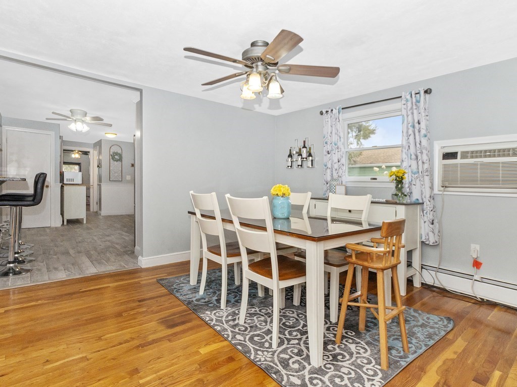 237 Linden Street Waltham, MA 02452 - Photo 16 of 33 a dining room with furniture a rug and wooden floor