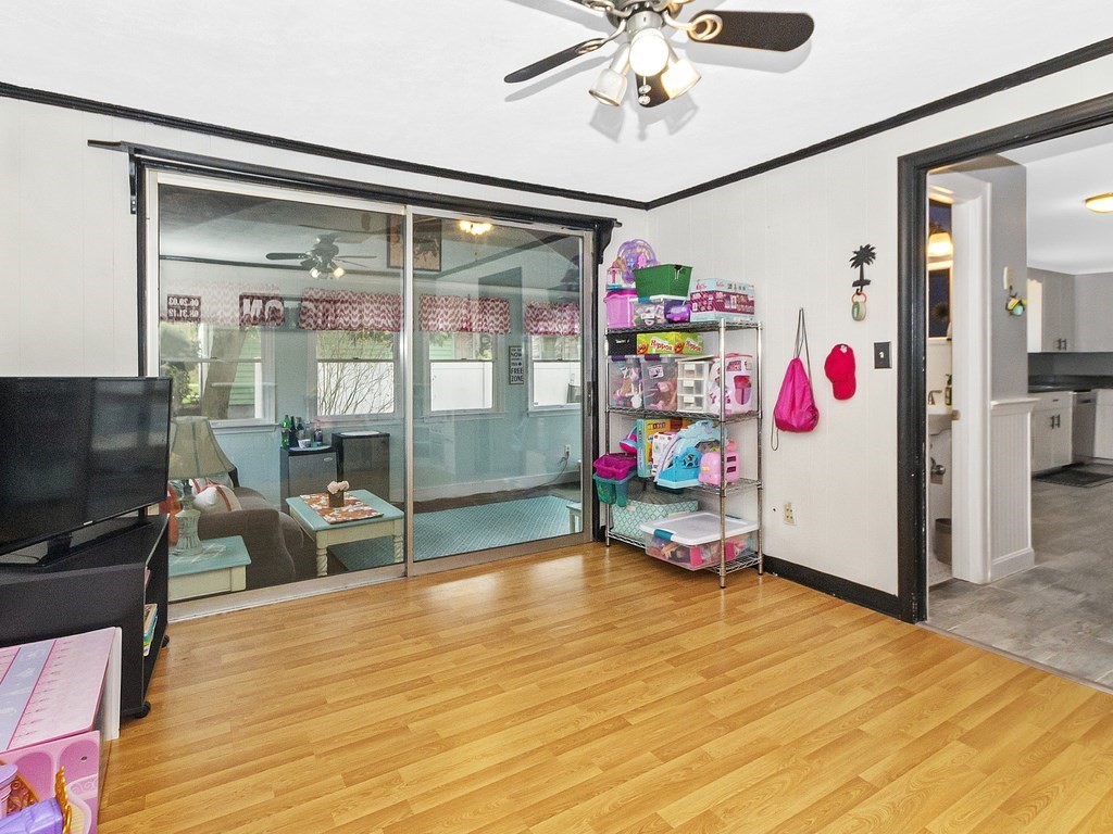 237 Linden Street Waltham, MA 02452 - Photo 19 of 33 a room with ceiling fan and a wooden floor