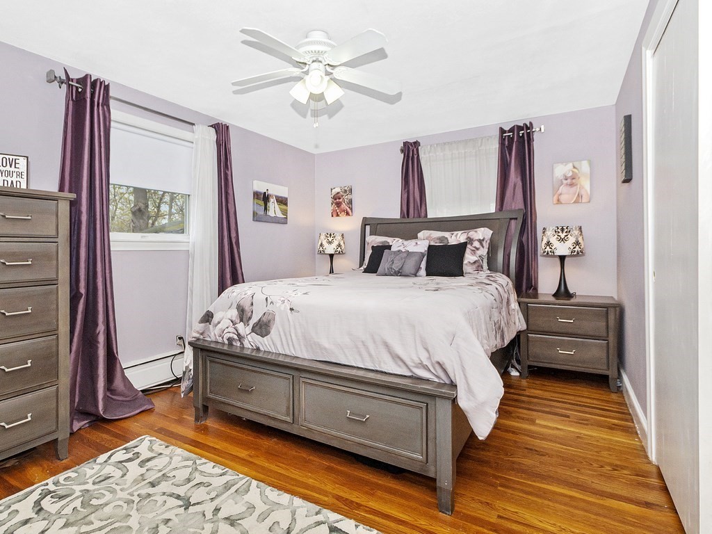 237 Linden Street Waltham, MA 02452 - Photo 20 of 33 a bedroom with a bed dresser and a window